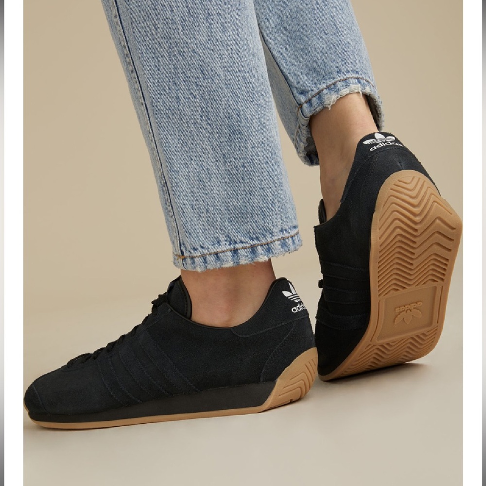 Khaite x Adidas Originals black sneakers.